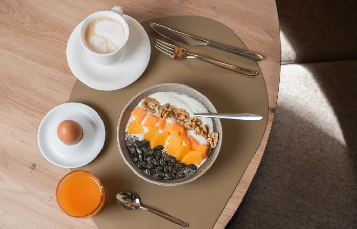 Muesli, eggs, and drinks on the table
