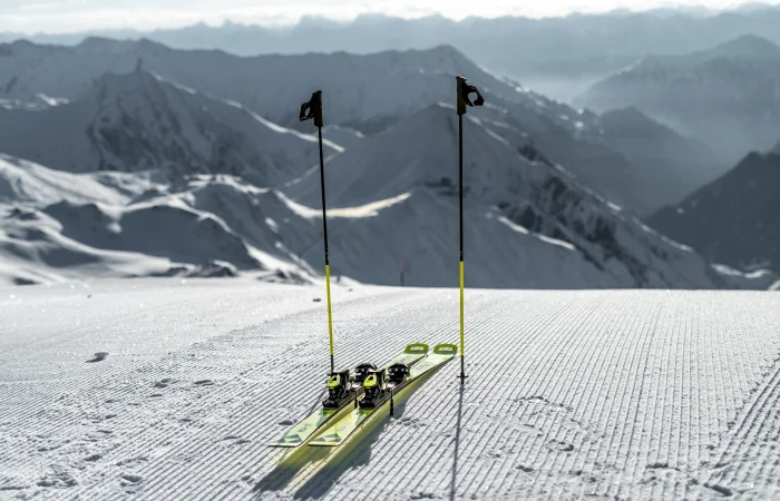 Skis and ski poles on the slope